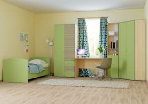 стол, кровать и пеналы в детской комнате
